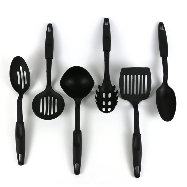 Ensemble d'ustensiles de cuisine : pelle, cuillère, poêle antiadhésive