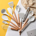Ensemble d'ustensiles de cuisine en silicone avec poignées en bois blanc marbré